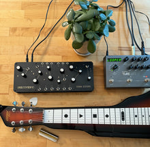 Seven Sisters placed on a desk with other synth gear, illustrating home or studio use.