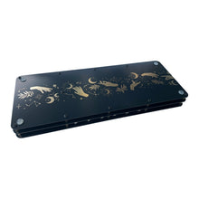 Back of Seven Sisters percussion synthesizer showing gold artwork on the enclosure.